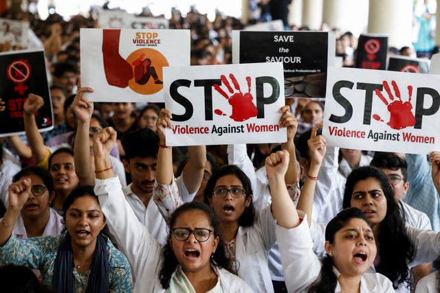 <p>Resident doctors hold posters and shout slogans during the protest against condemning the rape and murder of a trainee medic at a government-run hospital in Kolkata, at a Medical college in Ahmedabad</p>