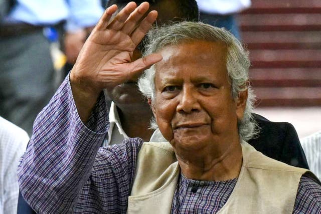 <p>Muhammad Yunus greets people after laying a wreath at the National Martyrs' Memorial in Dhaka</p>