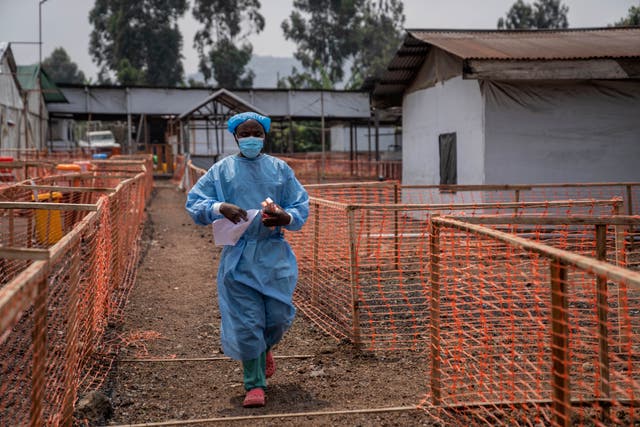 <p>A health worker walks past a mpox treatment centre in Munigi, eastern Congo</p>