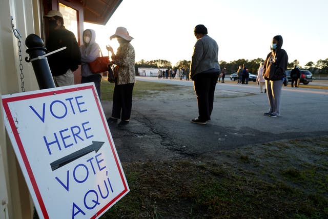 <p>People line up to vote in Atlanta, Georgia in 2020. The Cobb County Board of Commissioners approved funding to buy panic buttons for election workers amid rising threats against them</p>