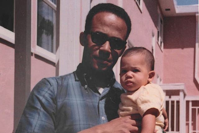 <p>Donald Harris on his way to a doctorate in economics at Berkeley in April 1965 while holding Kamala</p>