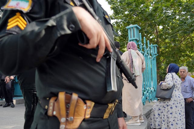 <p>File. A policeman stands guard outside a polling station during voting in Tehran for the Islamic republic’s presidential election on 28 June 2024</p>