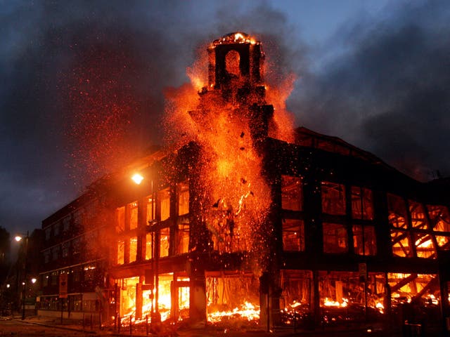 <p>Fire rages through a building in Tottenham during the 2011 riots</p>