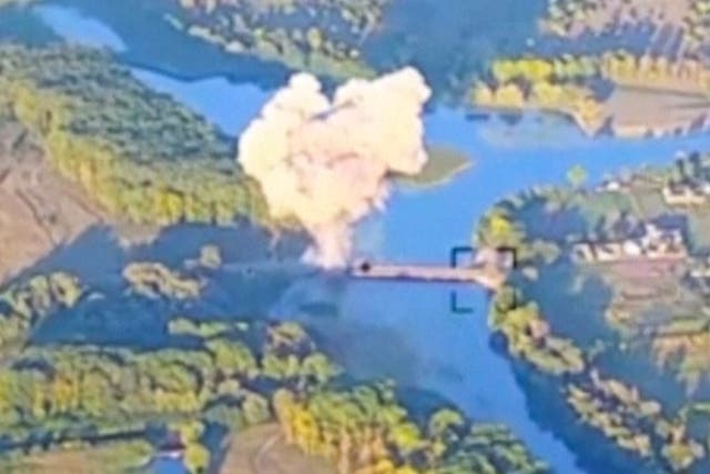 <p>Smoke billows in . what is said to show the destruction of a key bridge in Russia's Kursk region</p>