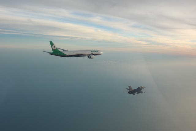 <p>Taiwan’s F-16 flies alongside the EVA Air flight carrying Taiwanese Olympic athletes coming home to Taipei </p>